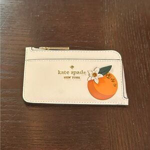 Kate Spade Cream Card Holder with Orange Design
